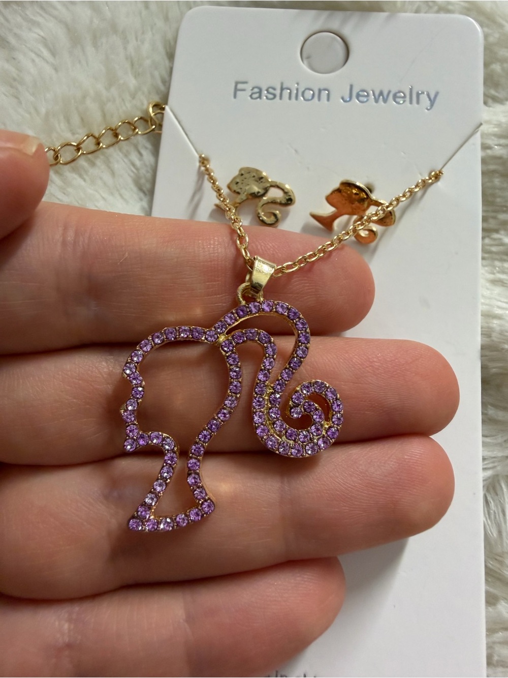 Gold-Tone Silhouette Pendant Necklace with Purple Rhinestones